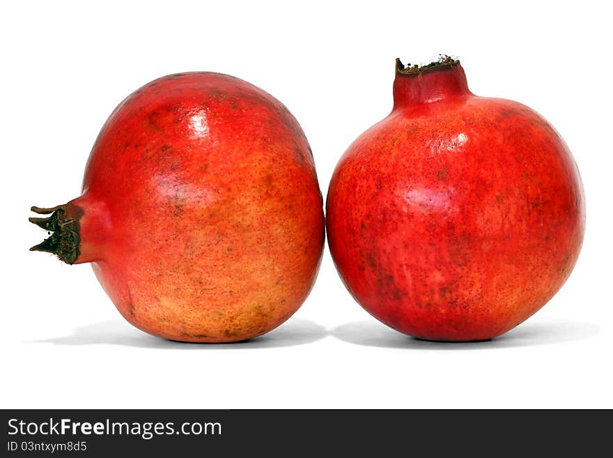 Whole pomegranate over white background