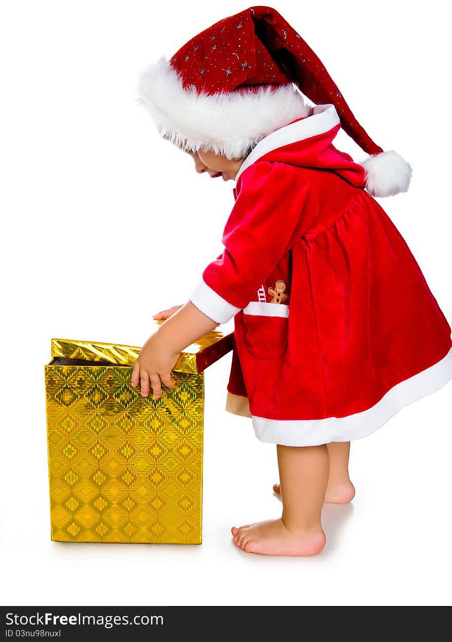 Christmas theme: little girl in santa hat with presents.