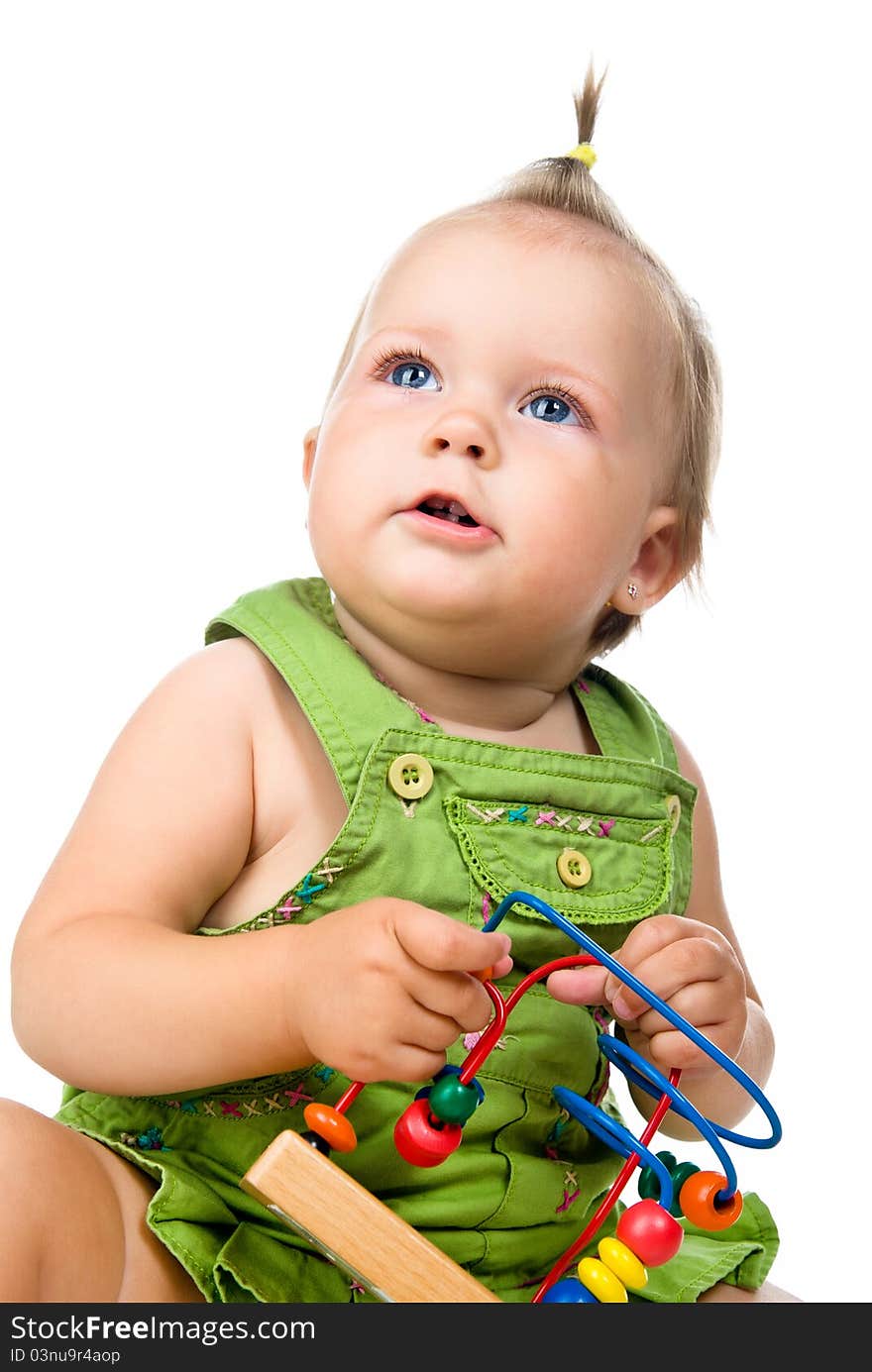 Small baby with developmental toy on a white background