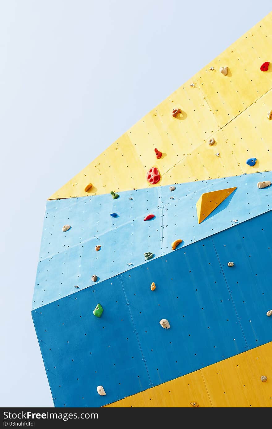 Rock climbing wall on white background