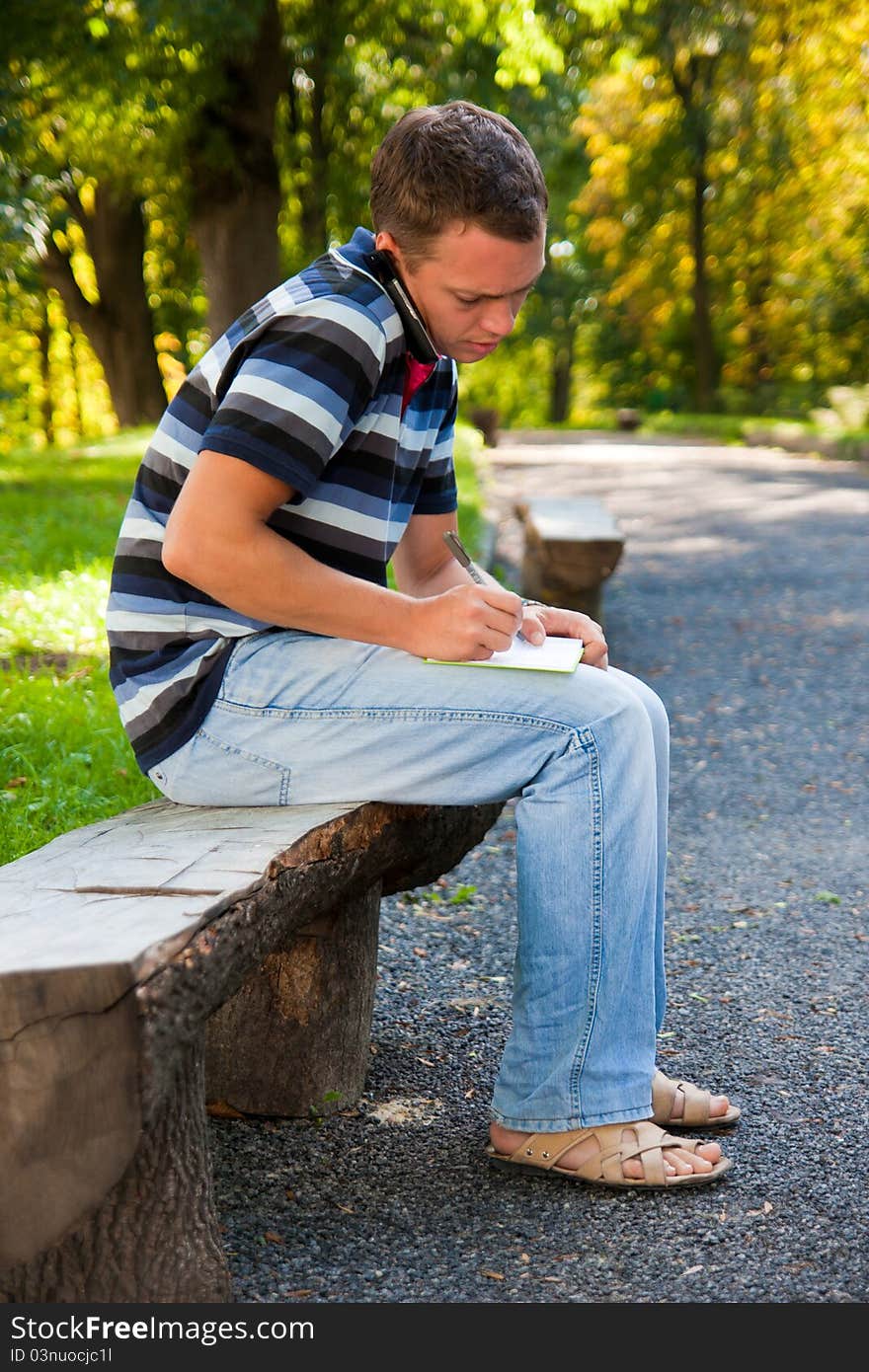 Man speaking on telephone in the park