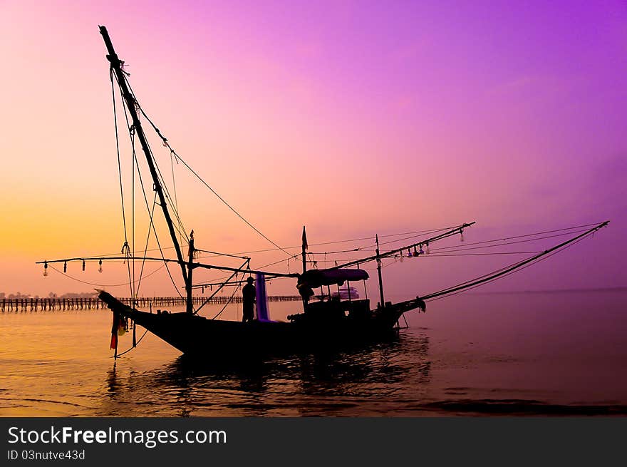 Sunset over Silhouette and the fishing boat. Sunset over Silhouette and the fishing boat