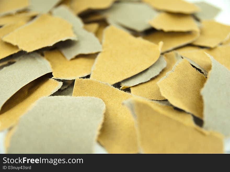 Close up pieces of torn brown paper. Close up pieces of torn brown paper.