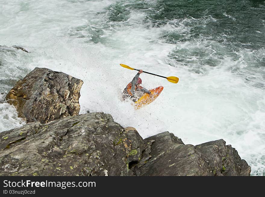 Kayaker in the waterfall