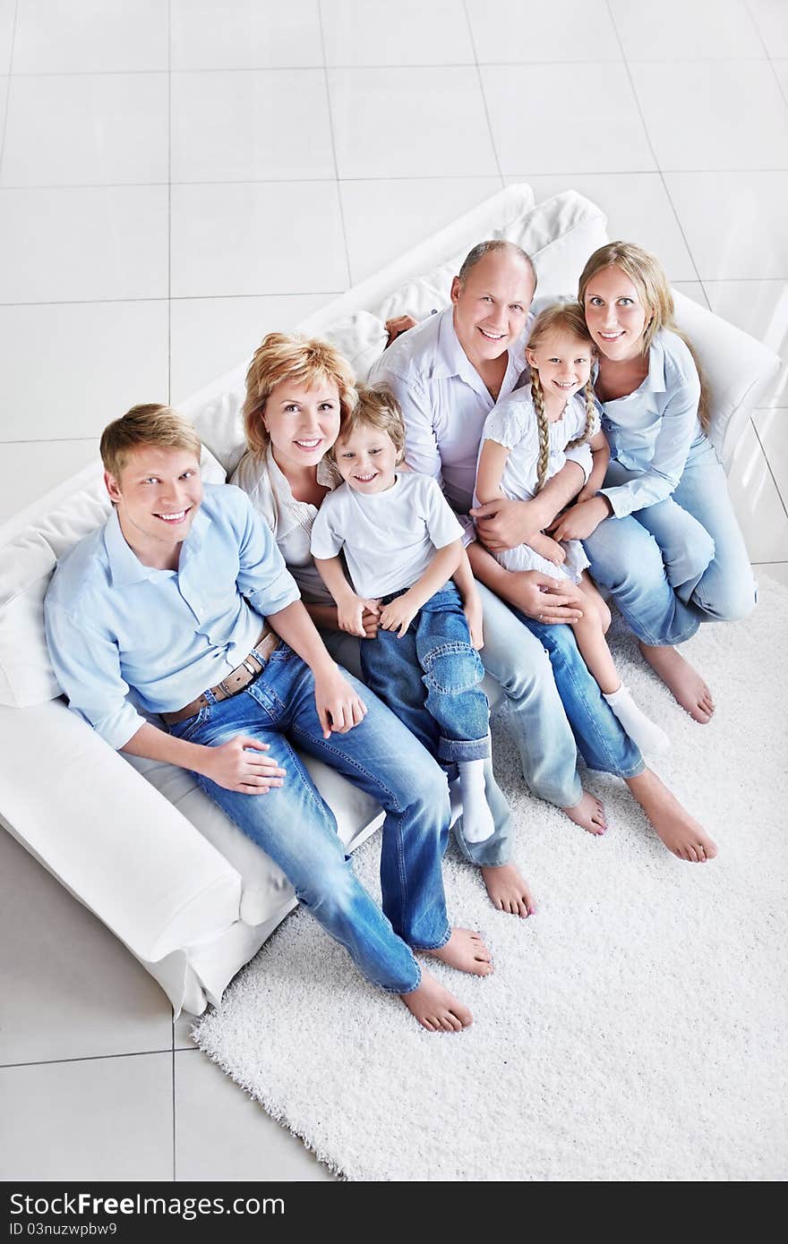 Happy family with children and grandchildren on the couch. Happy family with children and grandchildren on the couch