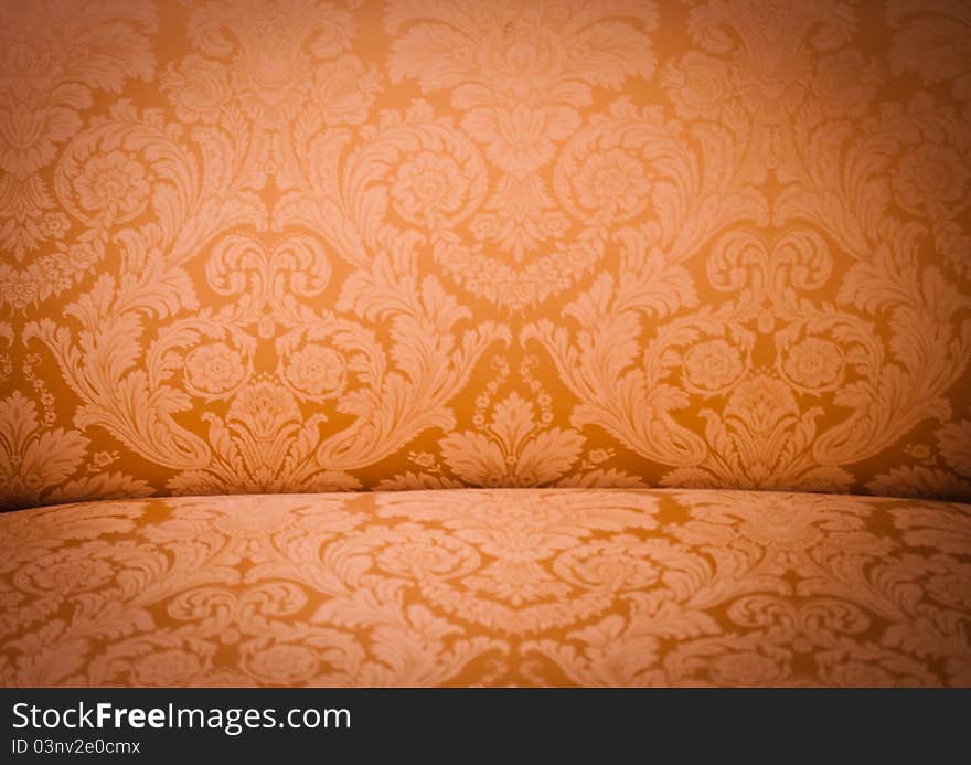 Golden Pattern on a sofa back with vignette. Golden Pattern on a sofa back with vignette