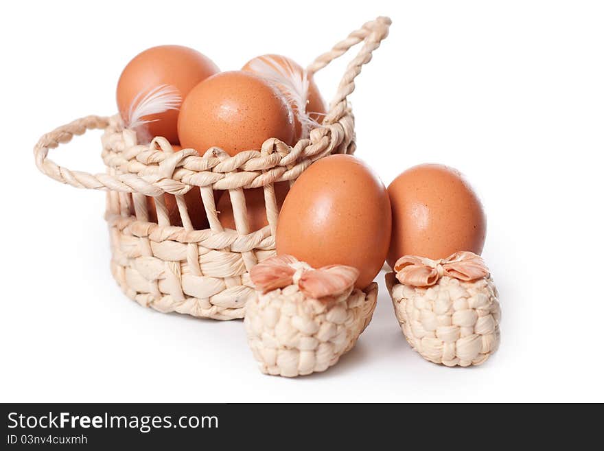 Eggs in the basket on a white background