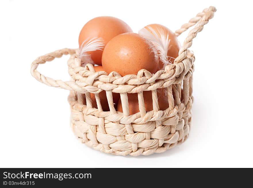 Eggs in the basket on a white