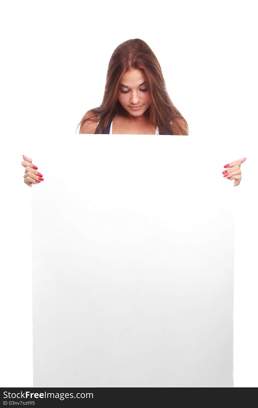 Portrait of a beautiful woman holding a blank billboard, looking out from behind it.