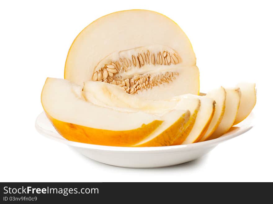 Fresh galia melon halves on a white background