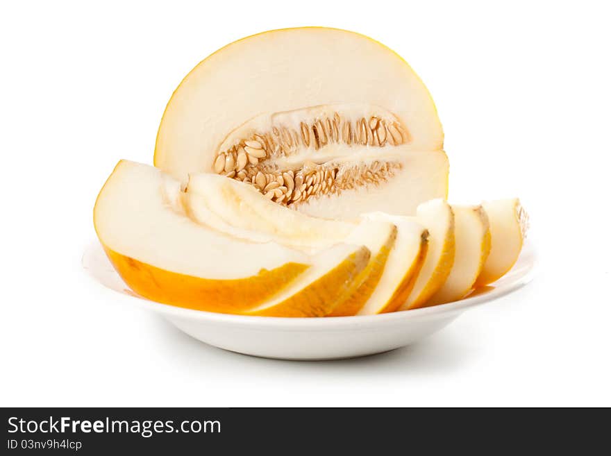 Fresh galia melon halves on a white background