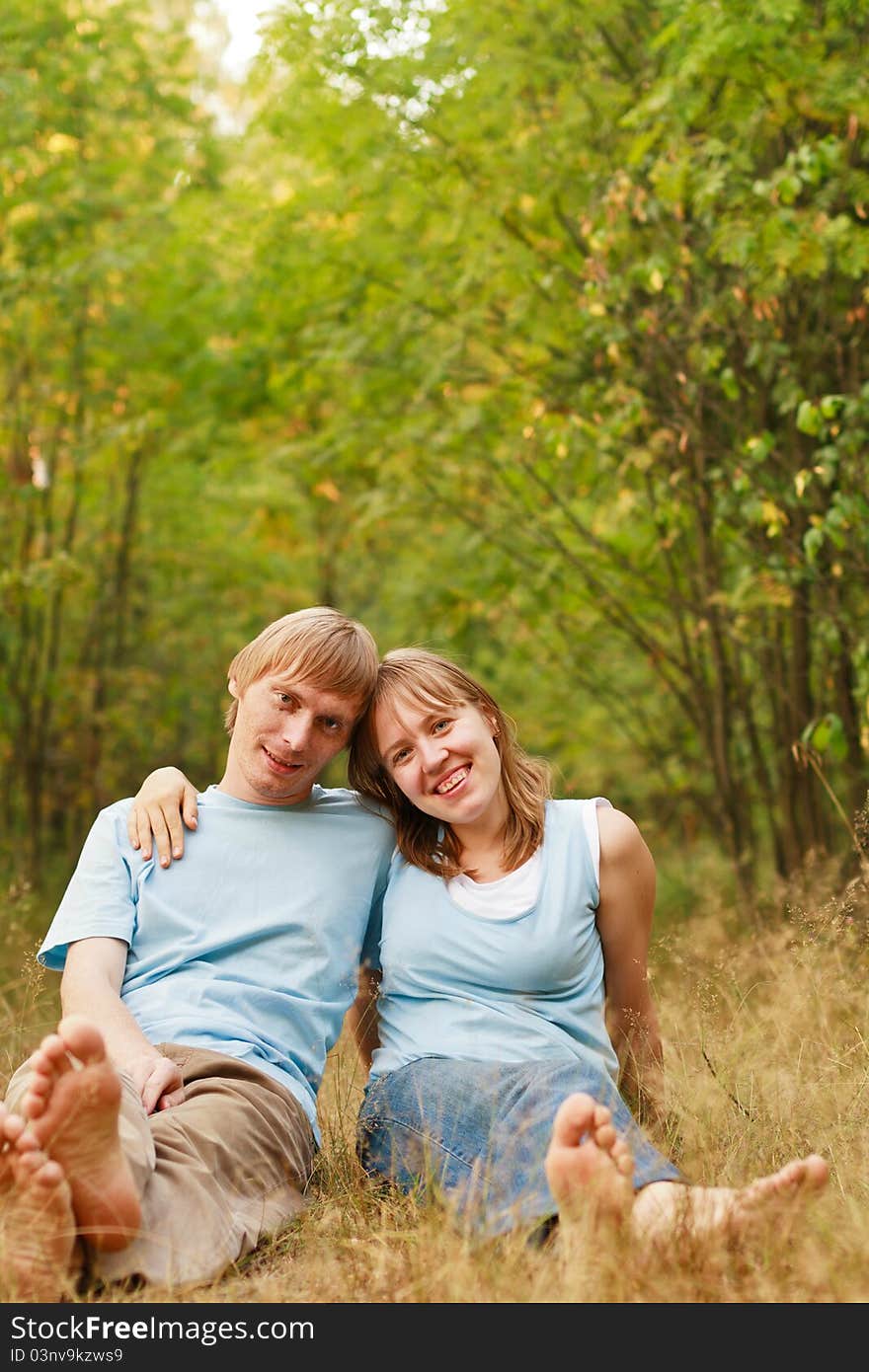 Young loving couple in summer nature. Young loving couple in summer nature