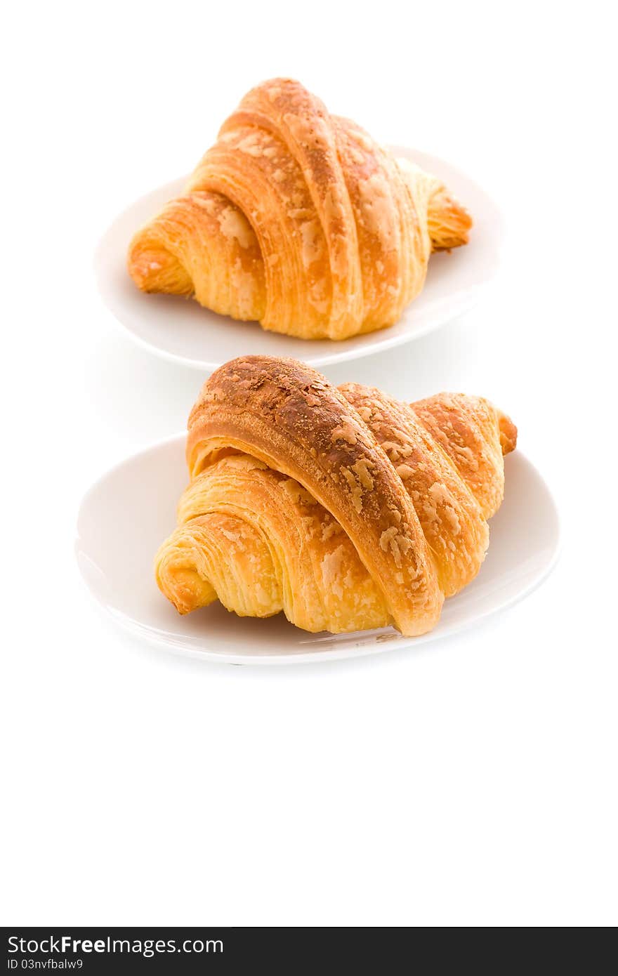 Photo of delicious tasty golden croissants on white background