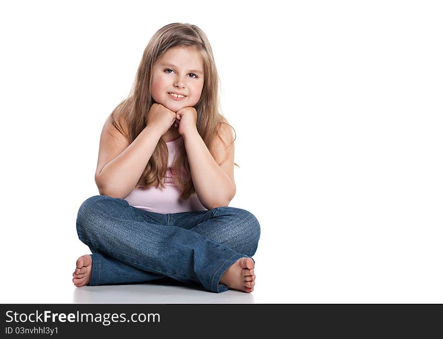 Portrait of a cute happy little girl sitting on floor. Portrait of a cute happy little girl sitting on floor