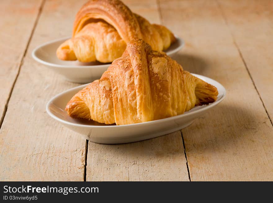 Croissants On Wooden Table