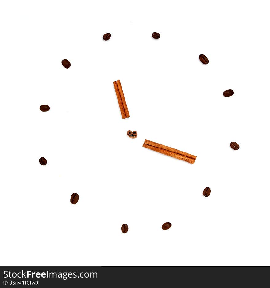 Coffee beans and cinnamon in the form of clock. Coffee beans and cinnamon in the form of clock