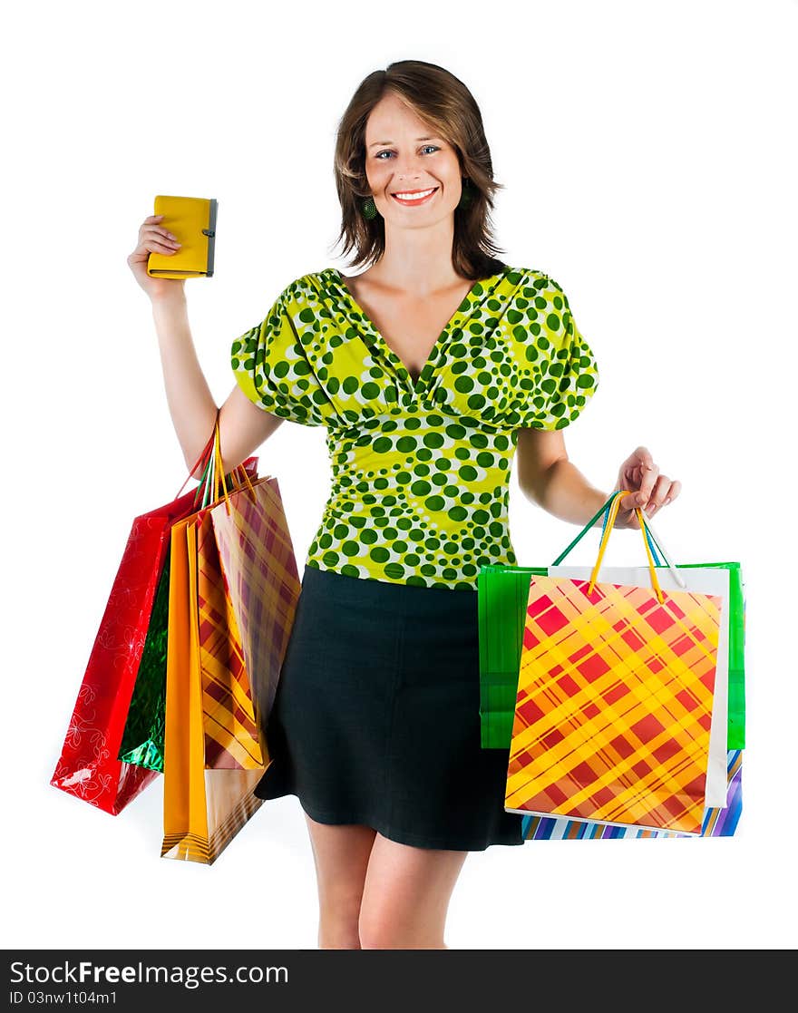 Beautiful woman with shopping bags on white