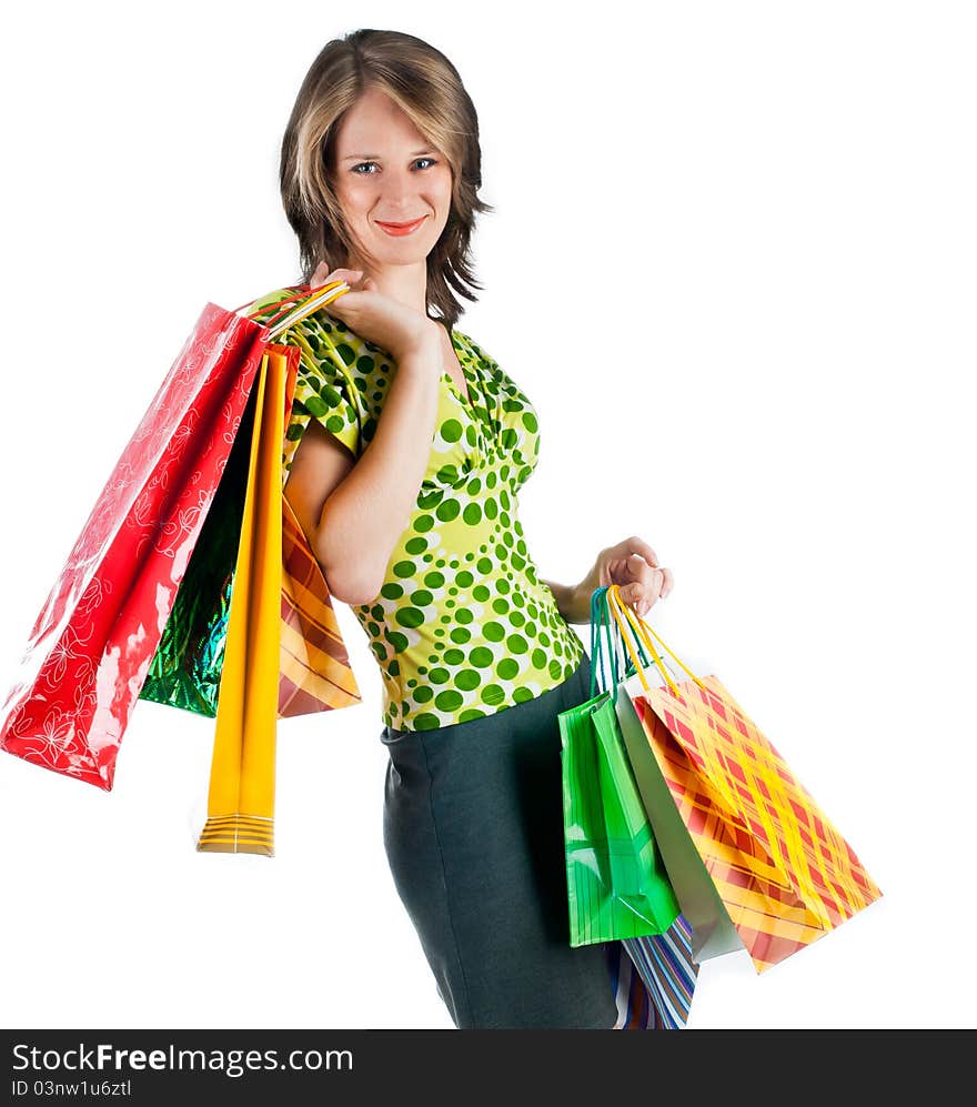 Beautiful woman with shopping bags on white