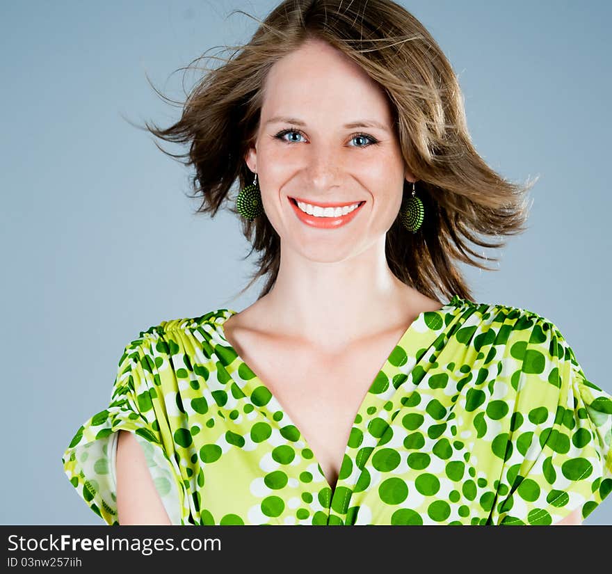 Beautiful young woman on a blue background