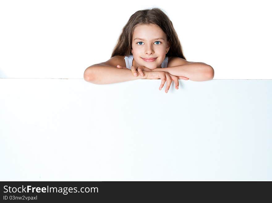 Nice girl beside a white blank for text or image. Nice girl beside a white blank for text or image