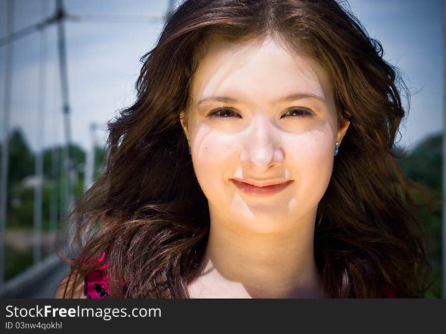 Portrait of young girl against blue sky. Portrait of young girl against blue sky