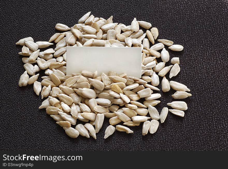 Closeup shot of sunflower seeds and blank label.