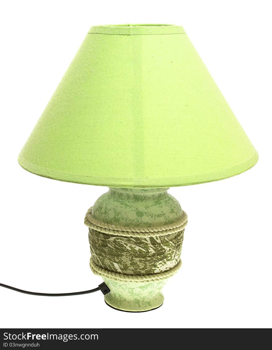 Tabletop green lamp on a white background