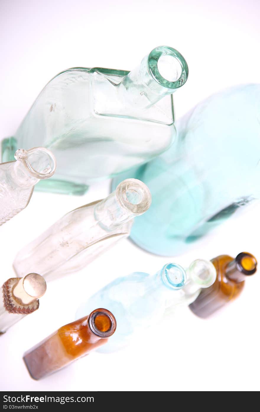 Vintage glass bottles on white