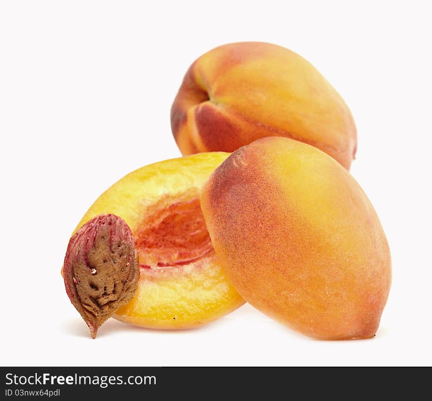 Fresh ripe peaches on white