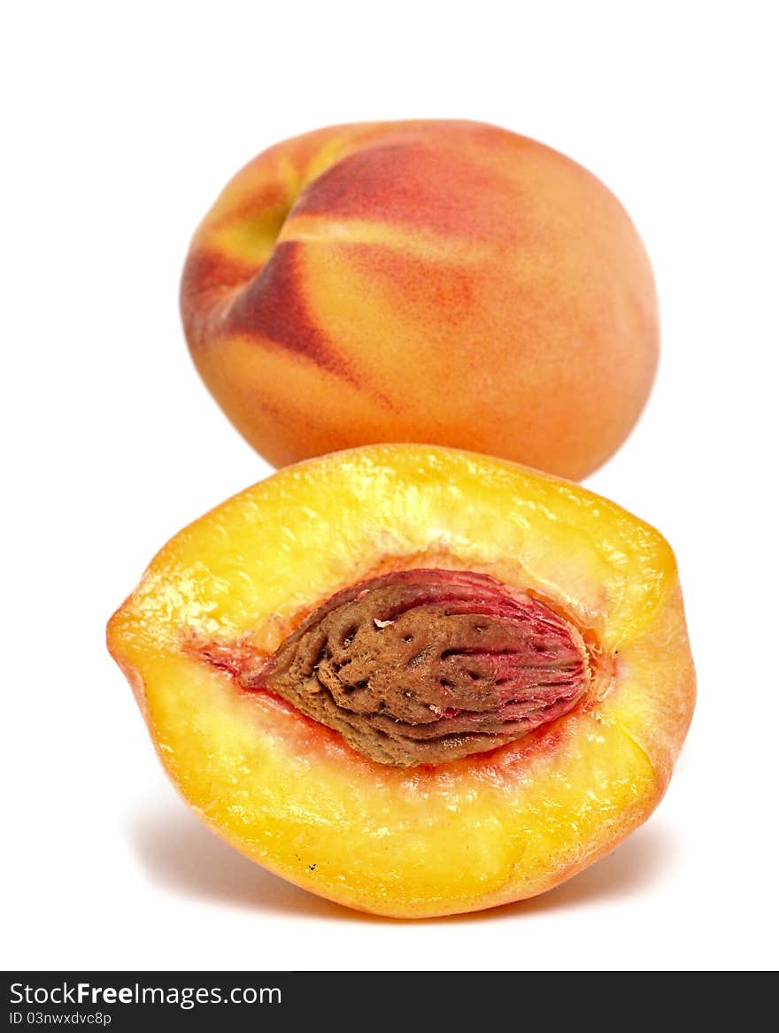 Fresh ripe peaches on white