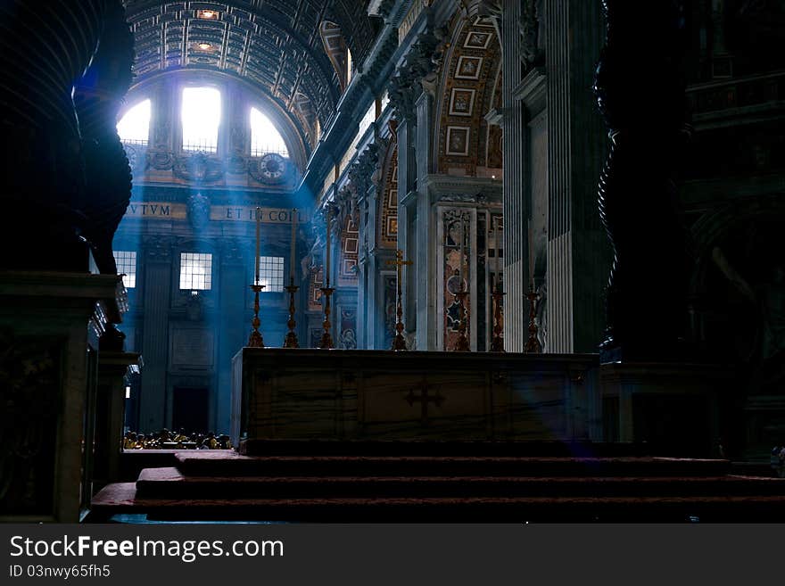 The mysterious morning sun light in San Pietro church in Vaticano. The mysterious morning sun light in San Pietro church in Vaticano