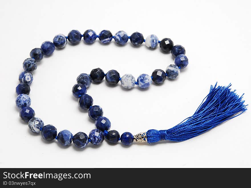 Blue Rosary Beads, from gem on white background