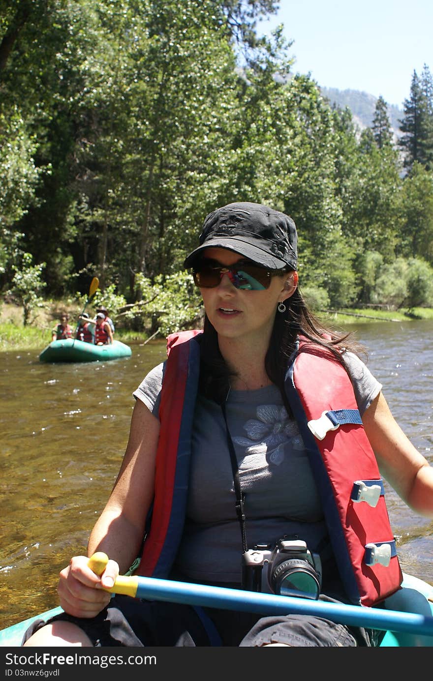 Woman Rafting On River