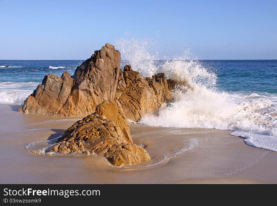 Waves crashing on the rocks in the ocean