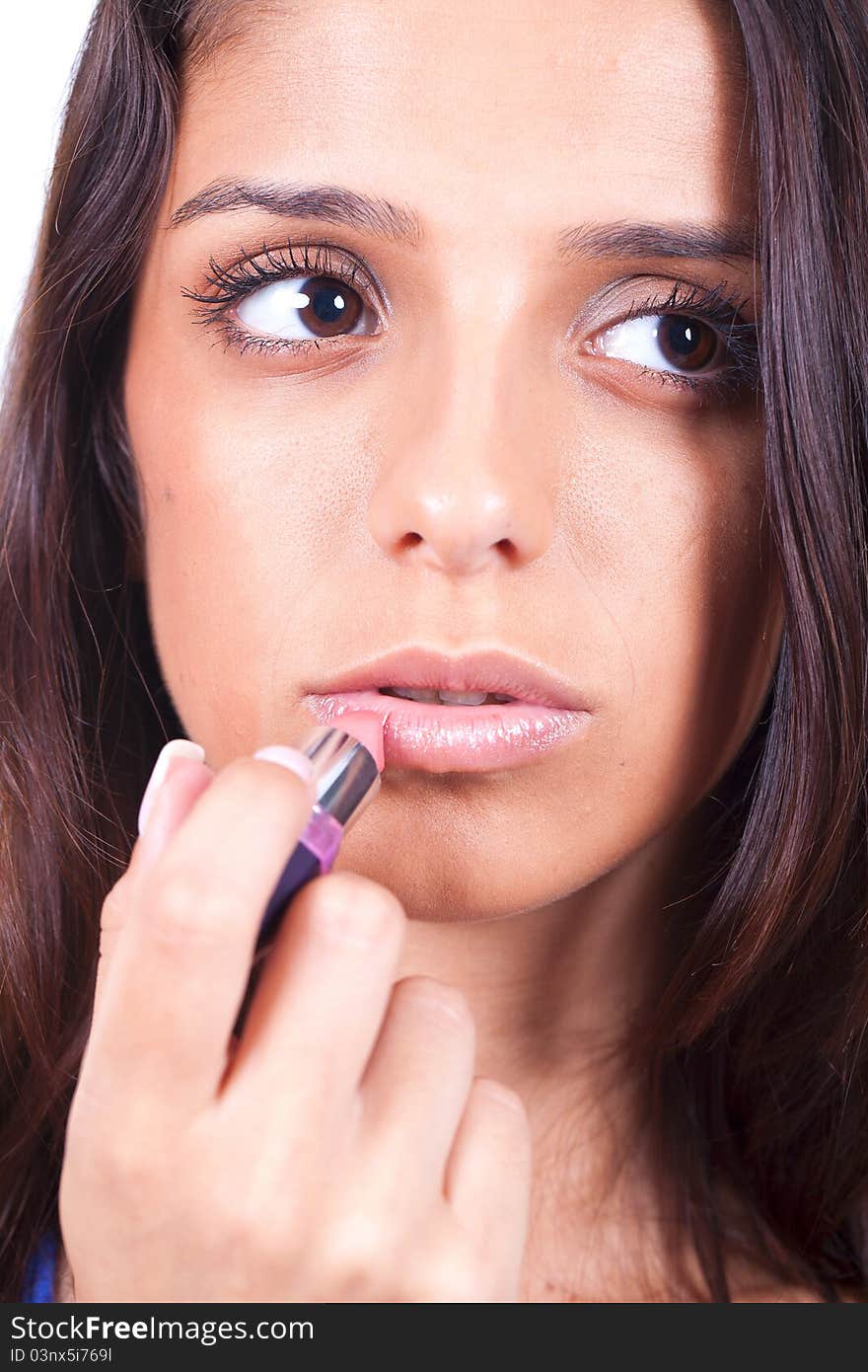 Beauty woman applying lipstick on lips