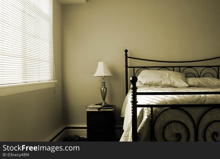 Sepia toned bedroom in the late afternoon