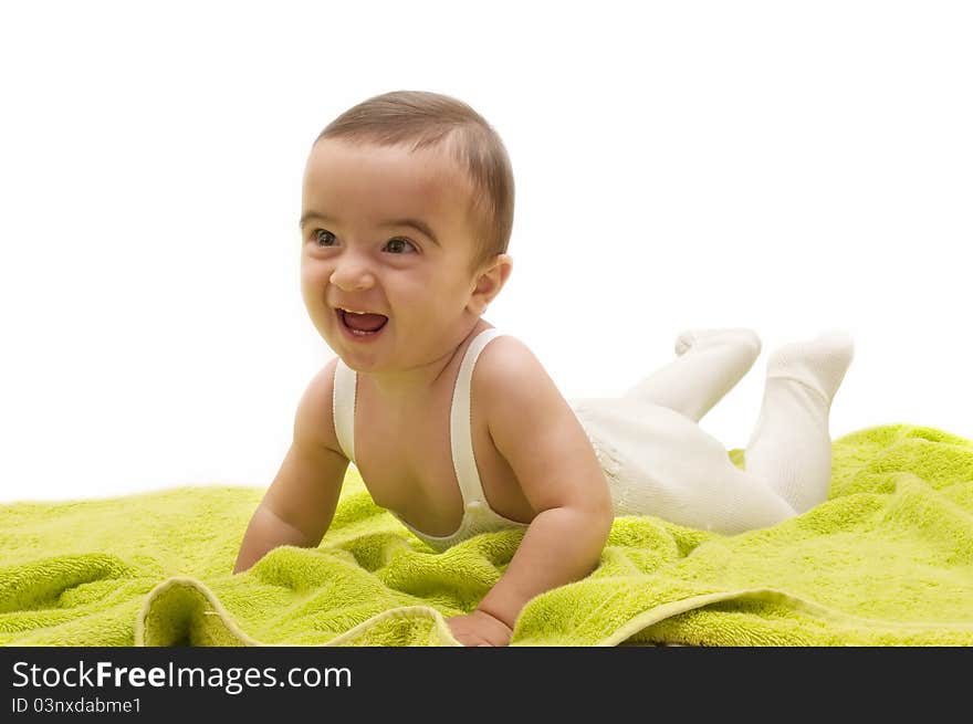 Beautiful baby with the green towel on white background. Beautiful baby with the green towel on white background