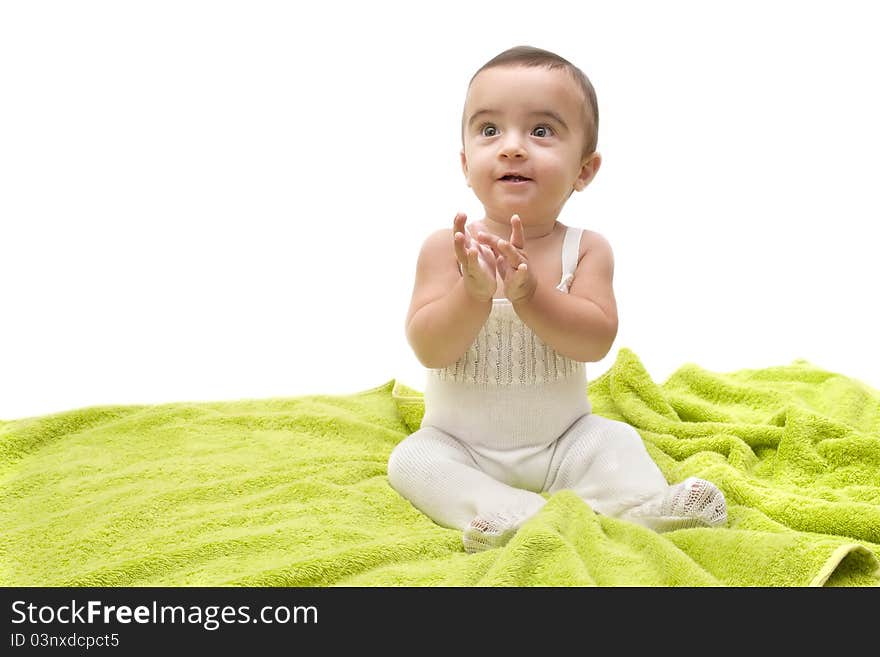 Beautiful baby with the green towel on white background. Beautiful baby with the green towel on white background