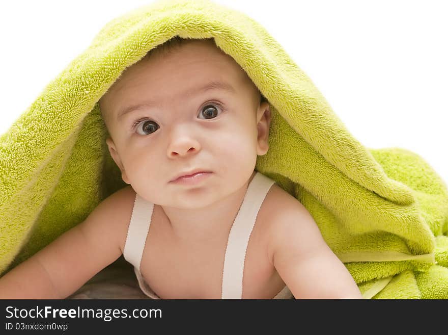 Beautiful baby with the green towel on white background. Beautiful baby with the green towel on white background