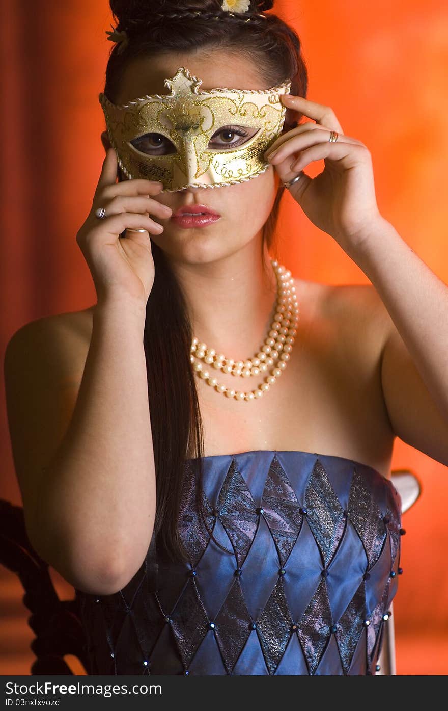 Young Teen woman at Masquerade Ball with long dark hair