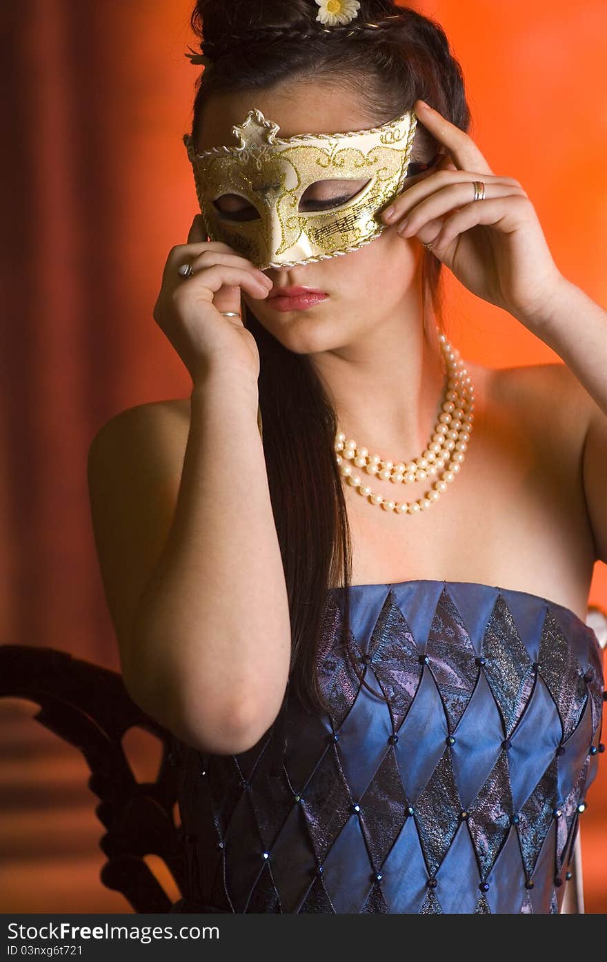 Young Teen woman at Masquerade Ball with long dark hair