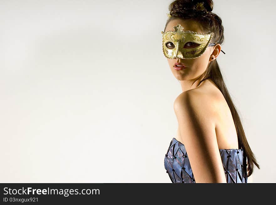 Young Teen woman at Masquerade Ball with long dark hair