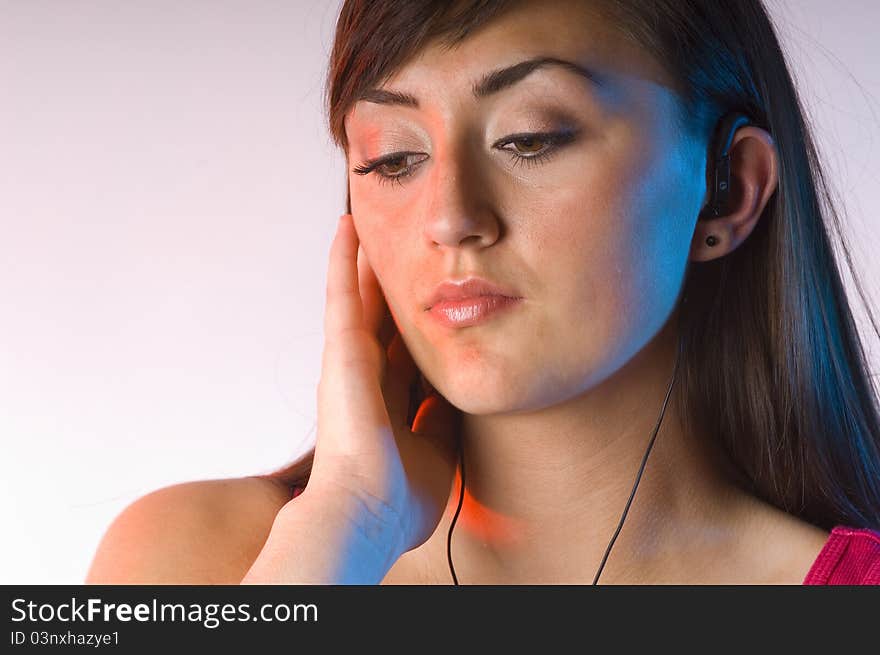 Teen Woman Listening To Music On White