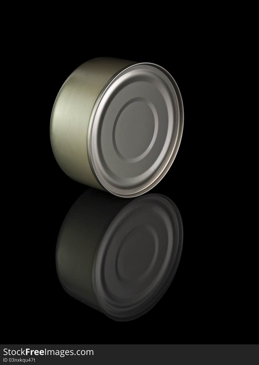 A golden tuna fish tin can and its reflection, isolated on black. A golden tuna fish tin can and its reflection, isolated on black.