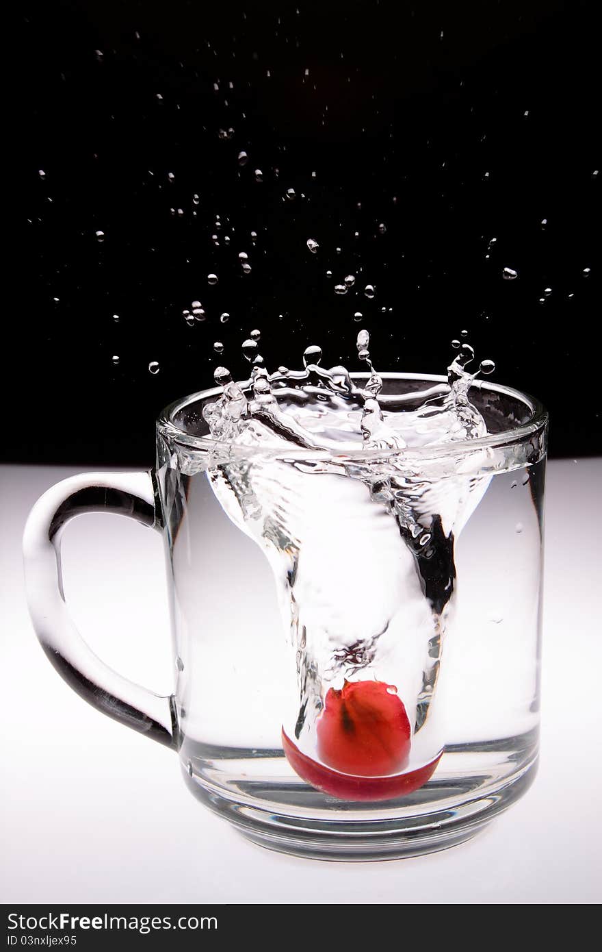 A Fruit drop in water. A Fruit drop in water.