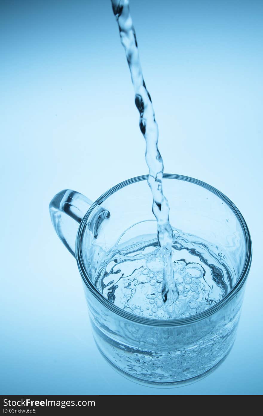 Water being poured into a glass.