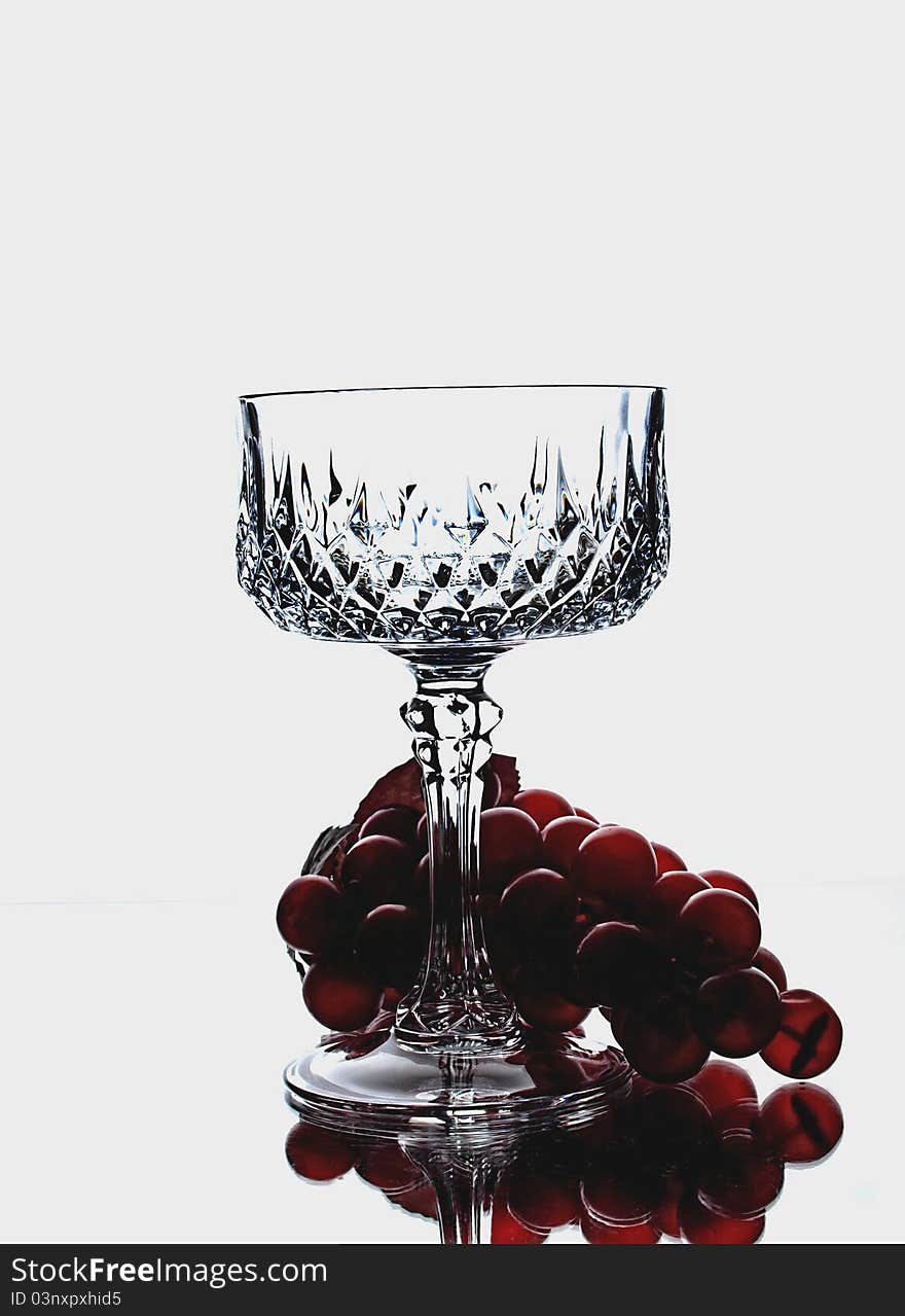 Abstract wine glassware background design with grapes. Abstract wine glassware background design with grapes.