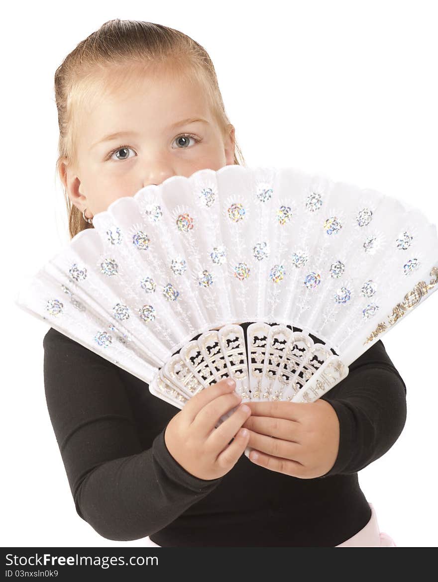 A pretty little preschooler peering over the fancysparkly white hand-fan she'd holding. A pretty little preschooler peering over the fancysparkly white hand-fan she'd holding.