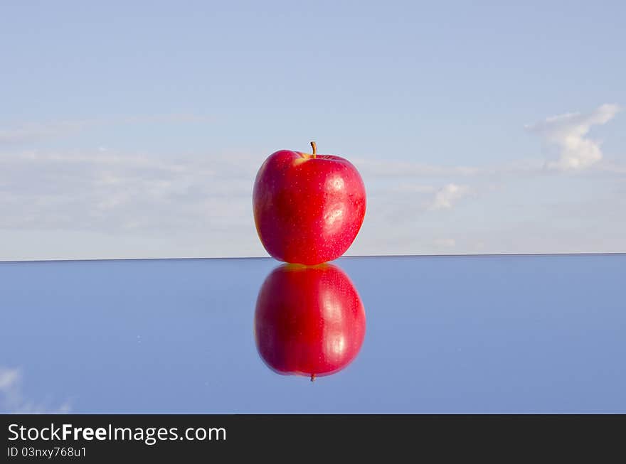 One Apple On Mirror And Sky