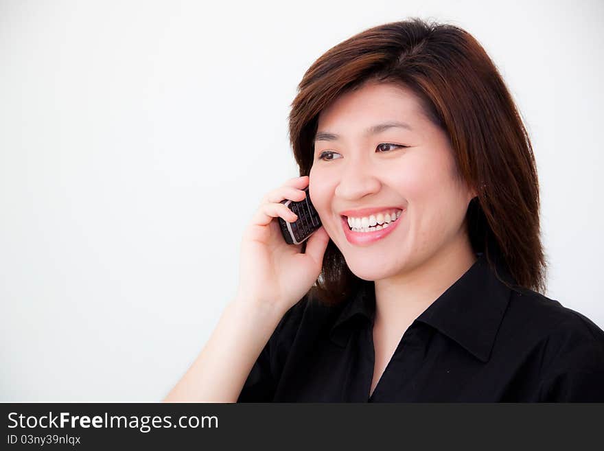 Asian woman in black shirt with telephone